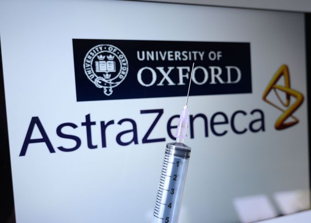 An image showing syringes in front of the Oxford University and Astra Zeneca logos